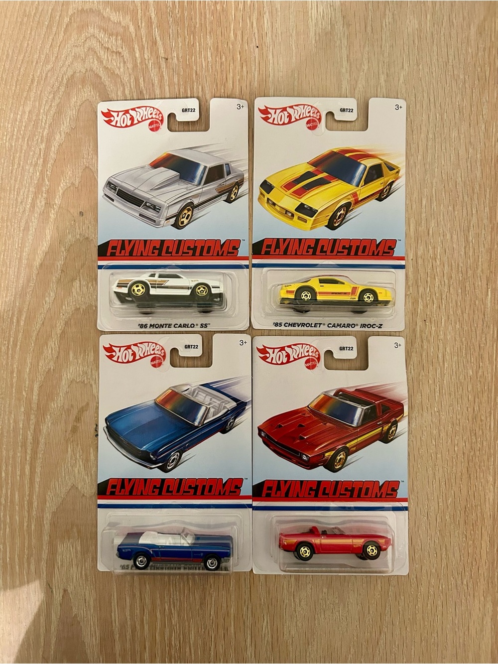 Hot Wheels Flying Customs 4-Pack Toy Cars — Red, Yellow, Blue, White